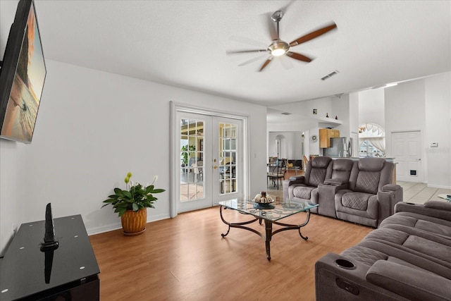2289 Jessica Ln, Kissimmee, FL 34744 - living room featuring light wood-type flooring, plenty of natural light, a ceiling fan, and visible vents
