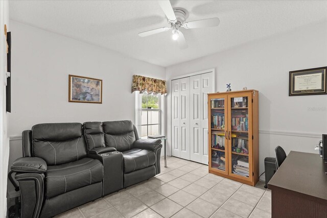 2289 Jessica Ln, Kissimmee, FL 34744 - living room featuring ceiling fan and light tile patterned floors