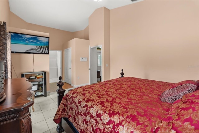 2289 Jessica Ln, Kissimmee, FL 34744 - bedroom featuring lofted ceiling and light tile patterned floors
