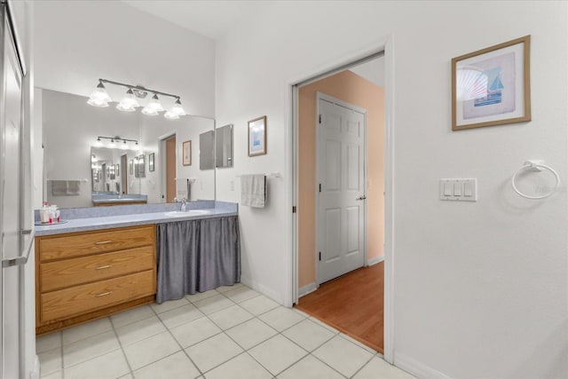2289 Jessica Ln, Kissimmee, FL 34744 - bathroom featuring baseboards, vanity, and tile patterned flooring