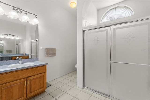 2289 Jessica Ln, Kissimmee, FL 34744 - full bath featuring a shower stall, toilet, vanity, and tile patterned flooring