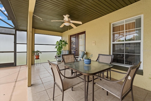 2289 Jessica Ln, Kissimmee, FL 34744 - sunroom featuring ceiling fan, a textured wall, and french doors