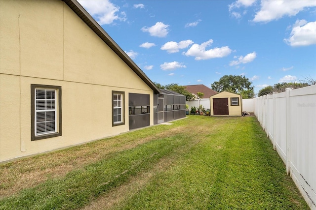2289 Jessica Ln, Kissimmee, FL 34744 - view of yard featuring a fenced backyard, an outdoor structure, and a storage shed