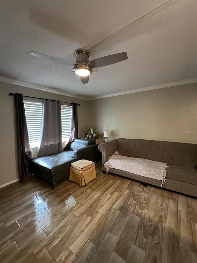 131 Water Front Way Unit 220, Altamonte Springs, FL 32701 - bedroom with wood finished floors, ornamental molding, a textured ceiling, and a ceiling fan