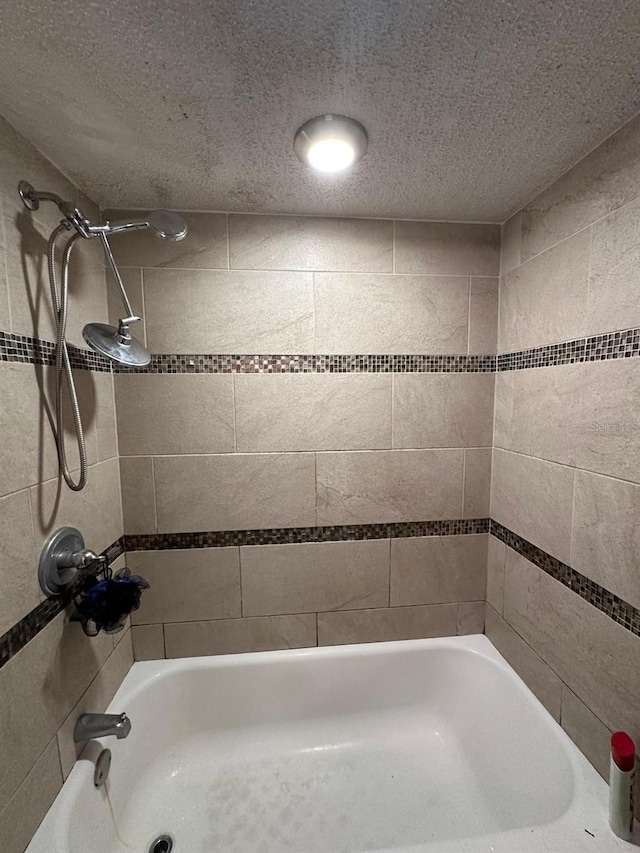 131 Water Front Way Unit 220, Altamonte Springs, FL 32701 - bathroom with bathing tub / shower combination and a textured ceiling