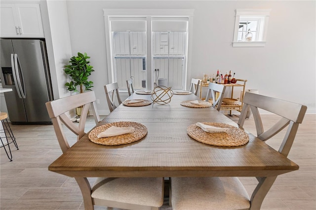 dining area featuring light wood-type flooring