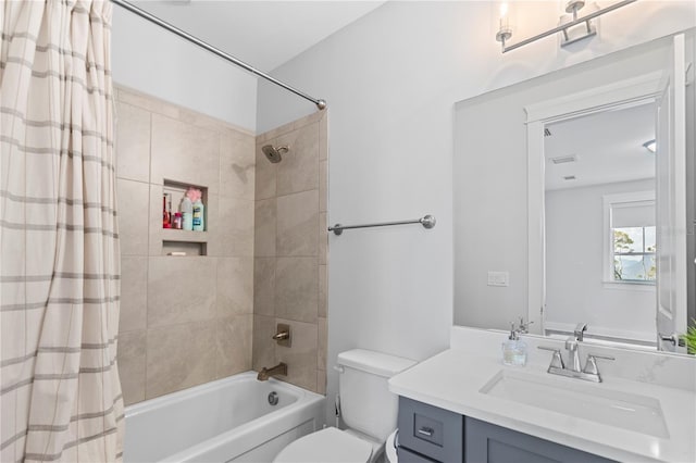 bathroom featuring shower / tub combo, toilet, and vanity
