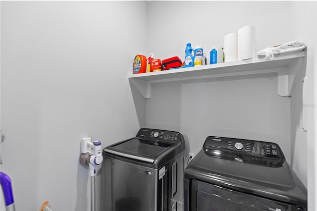 washroom with washing machine and clothes dryer