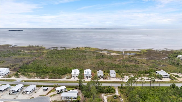 aerial view of property and surrounding area with a large body of water
