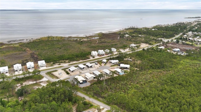 aerial overview of property's location with a large body of water and nearby suburban area