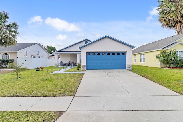 single story home featuring a garage, concrete driveway, a front yard, and stucco siding
