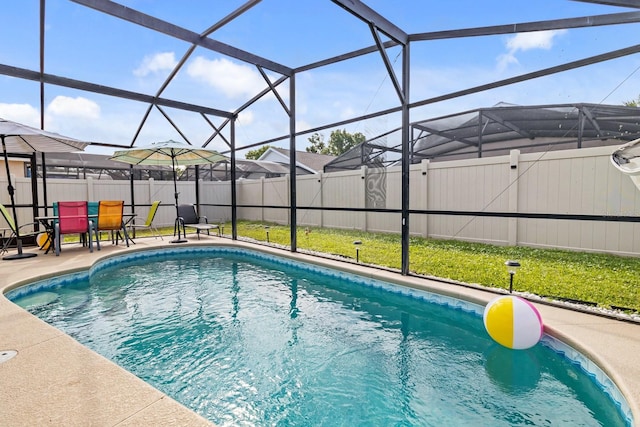 view of pool featuring a fenced backyard, a lanai, a patio area, and a fenced in pool
