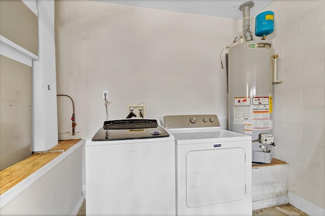washroom featuring separate washer and dryer, laundry area, and gas water heater