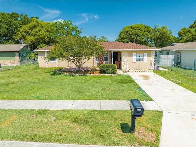 2430 Mill Run Blvd, Kissimmee, FL 34744 - single story home with driveway, stone siding, and stucco siding