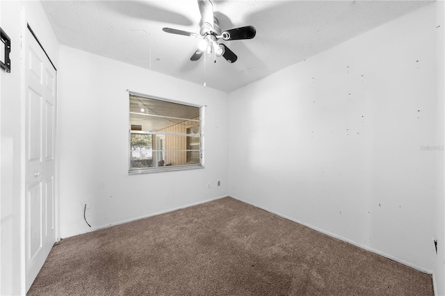 2430 Mill Run Blvd, Kissimmee, FL 34744 - unfurnished bedroom featuring carpet, a closet, and a ceiling fan
