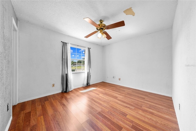 2430 Mill Run Blvd, Kissimmee, FL 34744 - empty room featuring a ceiling fan and wood finished floors