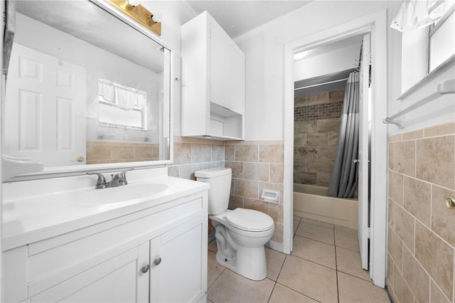 2430 Mill Run Blvd, Kissimmee, FL 34744 - full bath featuring tile walls, vanity, toilet, tile patterned floors, and shower / tub combo with curtain