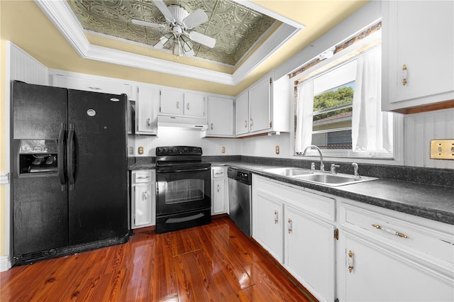 2430 Mill Run Blvd, Kissimmee, FL 34744 - kitchen featuring black appliances, a sink, under cabinet range hood, dark countertops, and dark wood-type flooring