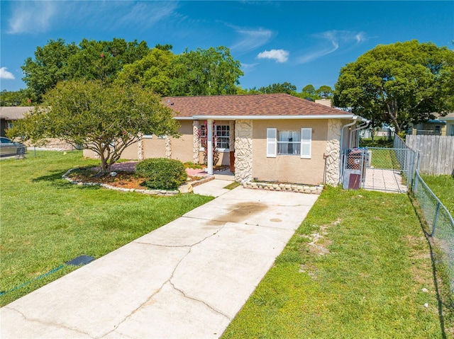 2430 Mill Run Blvd, Kissimmee, FL 34744 - view of front of home with stucco siding, driveway, and a gate