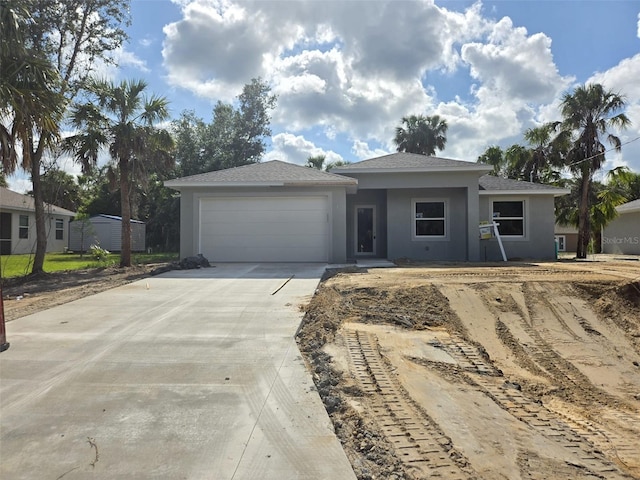 4098 New Milford St, North Port, FL 34288 - view of front of house with stucco siding, a garage, concrete driveway, and roof with shingles