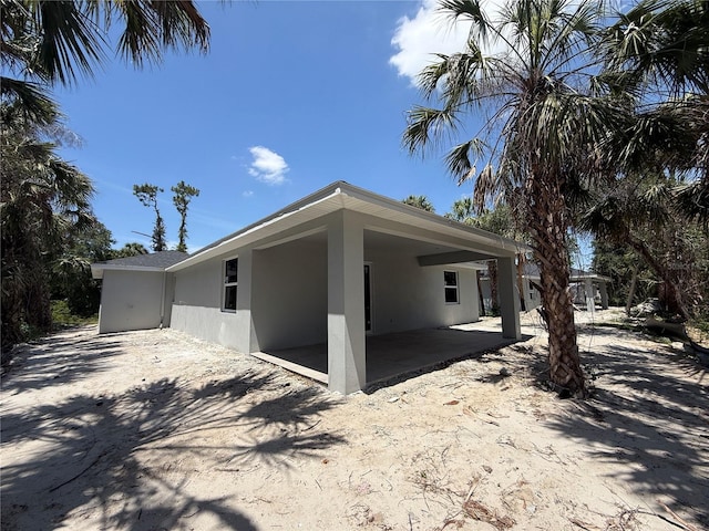 4098 New Milford St, North Port, FL 34288 - view of home's exterior with stucco siding and a patio