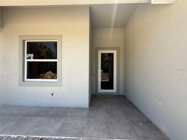 4098 New Milford St, North Port, FL 34288 - view of exterior entry featuring stucco siding