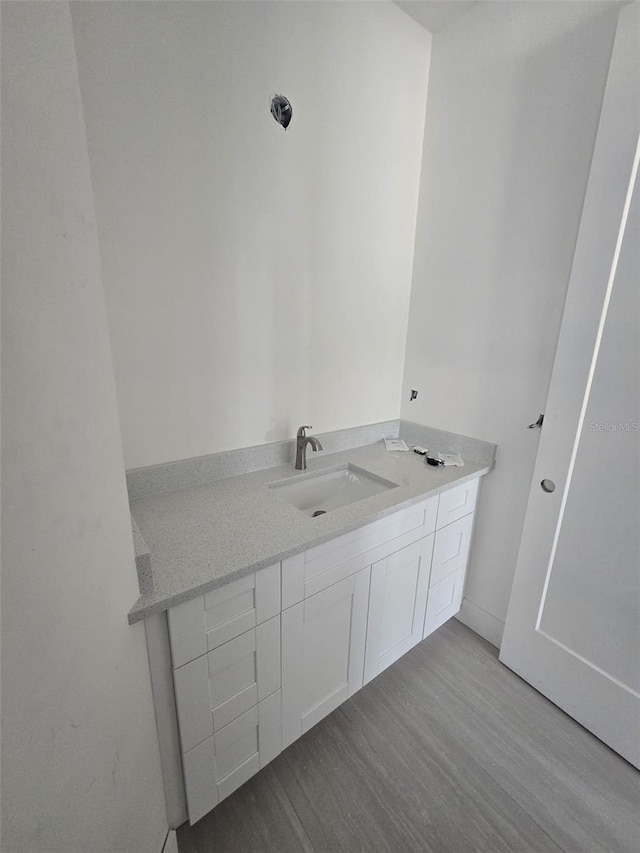 4098 New Milford St, North Port, FL 34288 - bathroom featuring wood finished floors and vanity