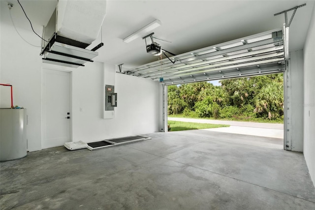 4098 New Milford St, North Port, FL 34288 - garage with electric panel, a garage door opener, and water heater