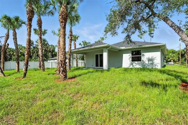 4098 New Milford St, North Port, FL 34288 - rear view of property featuring stucco siding