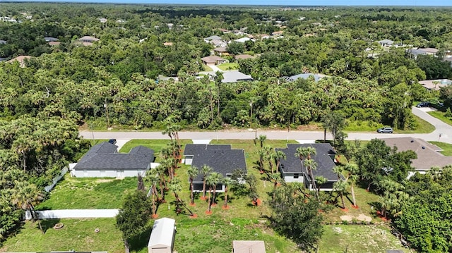 4098 New Milford St, North Port, FL 34288 - aerial perspective of suburban area with a heavily wooded area