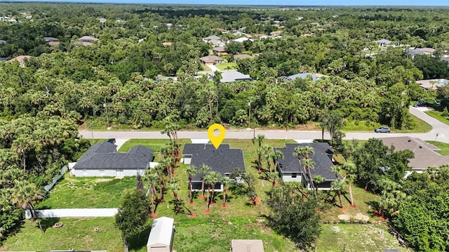 4098 New Milford St, North Port, FL 34288 - aerial view of residential area with a heavily wooded area