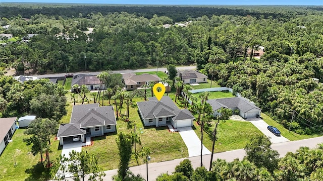 4098 New Milford St, North Port, FL 34288 - aerial view of residential area featuring a forest