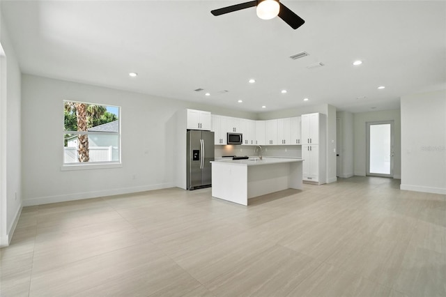4098 New Milford St, North Port, FL 34288 - kitchen with appliances with stainless steel finishes, open floor plan, recessed lighting, an island with sink, and a ceiling fan