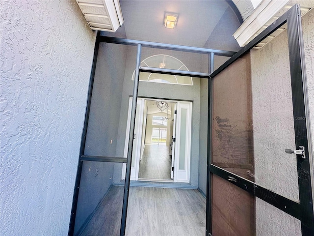property entrance featuring stucco siding