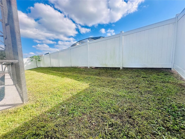 view of yard with a fenced backyard