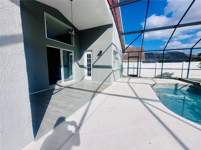 view of swimming pool featuring a lanai, a patio, and a fenced in pool