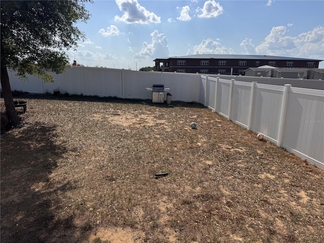 view of yard featuring a fenced backyard