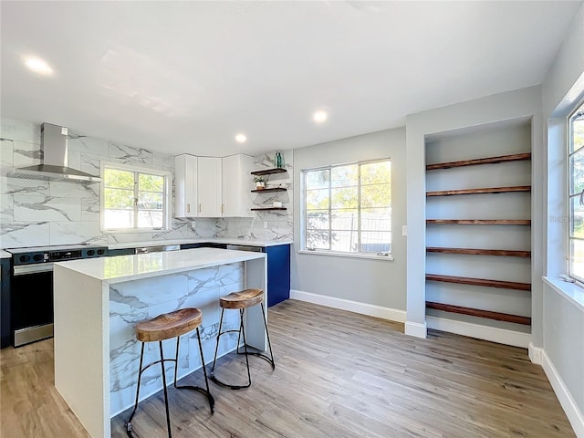 905 W 11th Ave, Mount Dora, FL 32757 - kitchen featuring exhaust hood, electric stove, open shelves, a center island, and backsplash