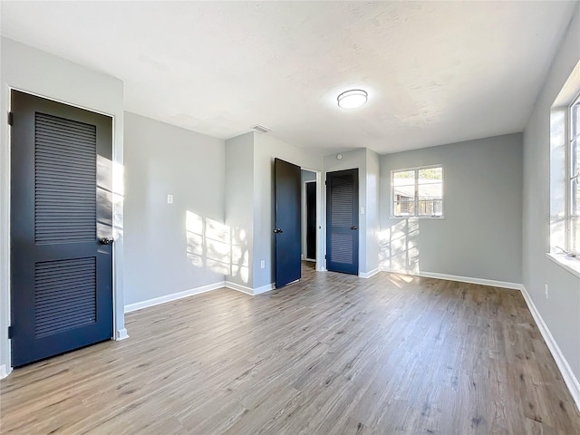 905 W 11th Ave, Mount Dora, FL 32757 - empty room with wood finished floors and baseboards