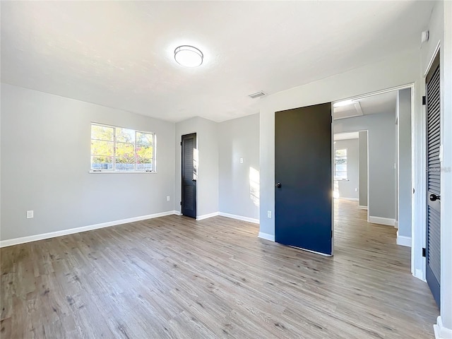905 W 11th Ave, Mount Dora, FL 32757 - empty room featuring plenty of natural light, light wood finished floors, and baseboards