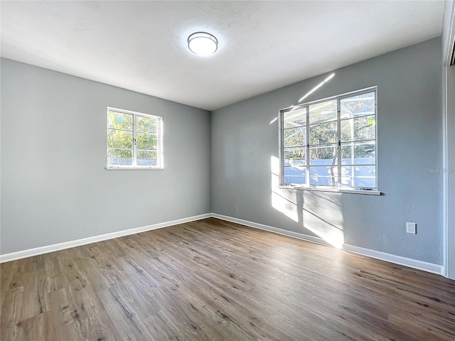 905 W 11th Ave, Mount Dora, FL 32757 - unfurnished room featuring wood finished floors and baseboards