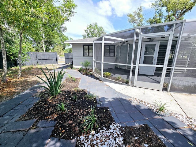 905 W 11th Ave, Mount Dora, FL 32757 - back of house with fence, a lanai, and a patio