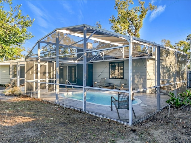 905 W 11th Ave, Mount Dora, FL 32757 - rear view of property with a patio area, an outdoor pool, and a lanai