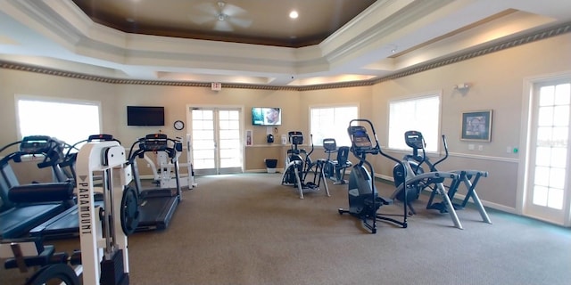 8809 Dunes Ct Unit 201, Kissimmee, FL 34747 - exercise room with a tray ceiling, crown molding, carpet floors, baseboards, and french doors