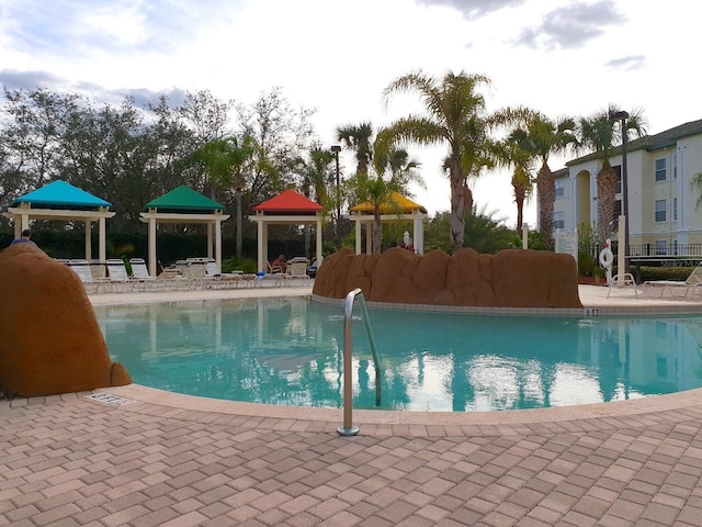 8809 Dunes Ct Unit 201, Kissimmee, FL 34747 - community pool featuring a gazebo and a patio area