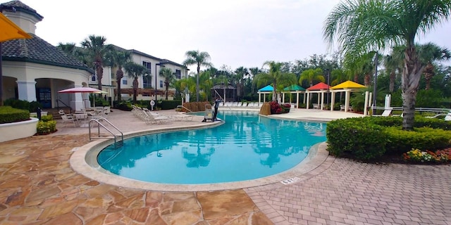 8809 Dunes Ct Unit 201, Kissimmee, FL 34747 - community pool featuring a patio area