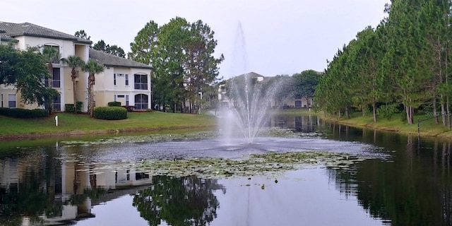 8809 Dunes Ct Unit 201, Kissimmee, FL 34747 - view of community with a water view and a yard