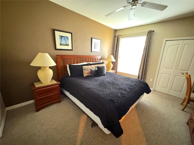 8809 Dunes Ct Unit 201, Kissimmee, FL 34747 - carpeted bedroom with a ceiling fan, a closet, and baseboards