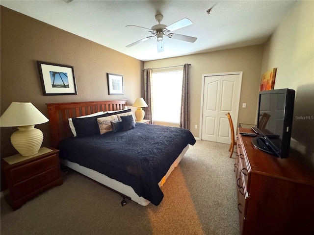 8809 Dunes Ct Unit 201, Kissimmee, FL 34747 - carpeted bedroom with ceiling fan and a closet