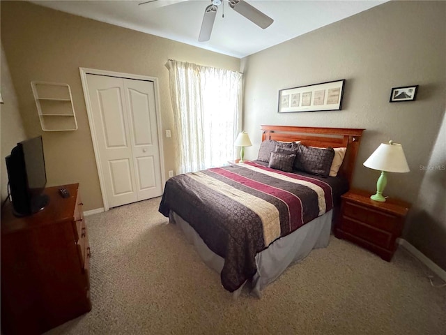 8809 Dunes Ct Unit 201, Kissimmee, FL 34747 - bedroom featuring carpet, baseboards, a closet, and ceiling fan